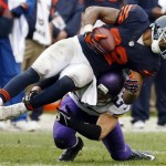 Chicago Bears running back Matt Forte, top, is tackled by Minnesota Vikings safety Harrison Smith during the second half of an NFL football game on Sunday, Sept. 15, 2013, in Chicago. (AP Photo/Charles Rex Arbogast)
