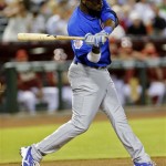 Chicago Cubs' Junior Lake hits a double against the Arizona Diamondbacks during the first inning of a baseball game on Wednesday, July 24, 2013, in Phoenix. (AP Photo/Matt York)