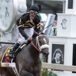 Jockey Gary Stevens celebrates aboard Oxbow after winning the 138th Preakness Stakes horse race at Pimlico Race Course, Saturday, May 18, 2013, in Baltimore. (AP Photo/Garry Jones)
