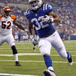  Indianapolis Colts running back Darren Evans (32) scores a touchdwon in front of Cincinnati Bengals linebacker Dontay Moch in the first half of an NFL preseason football game in Indianapolis, Thursday, Aug. 30, 2012. (AP Photo/John Sommers II)
