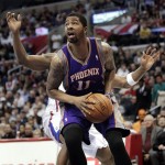 Phoenix Suns' Markieff Morris looks to shoot in front of Los Angeles Clippers' Bobby Simmons during the first half of an NBA basketball game in Los Angeles, Thursday, March 15, 2012. (AP Photo/Jae C. Hong)