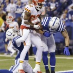 Kansas City Chiefs wide receiver Dwayne Bowe (82) scores a touchdown as Indianapolis Colts free safety Darius Butler (20) and strong safety LaRon Landry (30) defend during the first half of an NFL wild-card playoff football game Saturday, Jan. 4, 2014, in Indianapolis. (AP Photo/Michael Conroy)