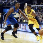  Indiana Pacers forward Paul George, right, works his way past Orlando Magic forward Maurice Harkless in the second half of an NBA basketball game in Indianapolis, Tuesday, Oct. 29, 2013. Indiana won 97-87. (AP Photo/R Brent Smith)
