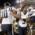 Mississippi running back Jeff Scott (3) is congratulated by defensive end C.J. Johnson (10) after Mississippi beat Vanderbilt 39-35 in an NCAA college football game on Friday, Aug. 30, 2013, in Nashville, Tenn. Scott scored a touchdown on a 75-yard run with 1:07 left in the fourth quarter to give Mississippi the win. (AP Photo/Mark Humphrey)