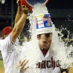 Arizona Diamondbacks first baseman Paul Goldschmidt (44), right, gets a water poured on him after hitting a walk off homerun against the Baltimore Orioles during a baseball game on Tuesday, Aug. 13, 2013, in Phoenix. (AP Photo/Rick Scuteri)