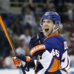 New York Islanders defenseman Matt Donovan celebrates after scoring a goal in the second period of an NHL hockey game against the Phoenix Coyotes at Nassau Coliseum in Uniondale, N.Y., Tuesday, Oct. 8, 2013. (AP Photo/Kathy Willens)