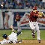Arizona Diamondbacks shortstop Cliff Pennington gets New York Yankees' Brett Gardner out at second after Vernon Wells hit into a first-inning double play in the Yankees' 4-3 winin a baseball game at Yankee Stadium in New York, Wednesday, April 17, 2013. (AP Photo/Kathy Willens)