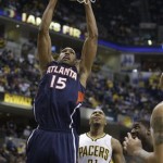 Atlanta Hawks' Al Horford (15) shoots against Indiana Pacers' David West during the first half of Game 1 in the first round of the NBA basketball playoffs on Sunday, April 21, 2013, in Indianapolis. (AP Photo/Darron Cummings)
