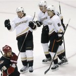 Anaheim Ducks' Matt Beleskey, left, celebrates his goal with teammates Corey Perry (10) and Ben Lovejoy (6) as Phoenix Coyotes' David Moss (18) skates by during the first period of an NHL hockey game, Monday, March 4, 2013, in Glendale, Ariz. (AP Photo/Matt York)