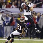 New Orleans Saints wide receiver Lance Moore (16) makes a catch in front of Atlanta Falcons defensive back Chris Owens (21) during the first half of an NFL football game, Thursday, Nov. 29, 2012, in Atlanta. (AP Photo/David Goldman)
