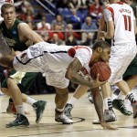 Louisville forward Chane Behanan, center, grabs a loose ball in front of Colorado State forward Pierce Hornung (4) in the first half of a third-round NCAA college basketball tournament game on Saturday, March 23, 2013, in Lexington, Ky. (AP Photo/John Bazemore)
