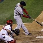 Boston Red Sox's David Ross hits an RBI double during the seventh inning of Game 5 of baseball's World Series against the St. Louis Cardinals Monday, Oct. 28, 2013, in St. Louis. (AP Photo/David J. Phillip)