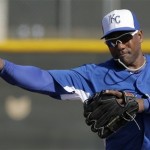Kansas City Royals' Miguel Tejada throws during a baseball spring training workout Thursday, Feb. 21, 2013, in Surprise, Ariz. (AP Photo/Charlie Riedel)