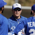 Kansas City Royals manager Ned Yost talks to pitchers during a spring training baseball workout, Tuesday, Feb. 12, 2013, in Surprise, Ariz. (AP Photo/Charlie Riedel)