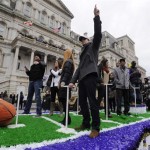 Baltimore Ravens rookie kicker Justin Tucker points to the sky at the start of a victory parade outside of City Hall Tuesday, Feb. 5, 2013 in Baltimore. The Ravens defeated the San Francisco 49ers in NFL football's Super Bowl XLVII 34-31 on Sunday. (AP Photo/Gail Burton)
