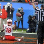 Nebraska wide receiver Quincy Enunwa (18) tossed the ball to an official after scoring a touchdown during the first half of the Gator Bowl NCAA college football game against Georgia, Wednesday, Jan. 1, 2014, in Jacksonville, Fla. (AP Photo/Stephen B. Morton)