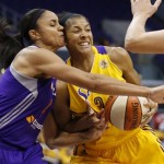 Phoenix Mercury's Candice Dupree, left, defends against Los Angeles Sparks' Candace Parker, right, during the first half in Game 1 of their WNBA basketball Western Conference semifinal series on Thursday, Sept. 19, 2013, in Los Angeles. (AP Photo/Danny Moloshok)