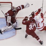 Phoenix Coyotes' Ilya Bryzgalov (30), of 
Russia, makes a save on a shot by Detroit Red 
Wings' Valtteri Filppula (51), of Finland, as 
Coyotes' Adrian Aucoin (33) defends during 
the third period in Game 4 of a first-round 
NHL hockey Stanley Cup playoffs series 
Wednesday, April 20, 2011, in Glendale, Ariz. 
The Red Wings defeated the Coyotes 6-3 and 
earned a 4-0 sweep in the series. (AP 
Photo/Ross D. Franklin)