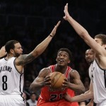 Brooklyn Nets guard Deron Williams (8)] and center Brook Lopez, right, surround Chicago Bulls forward Jimmy Butler (21) in the second half of Game 5 of their first-round NBA basketball playoff series, Monday, April 29, 2013, in New York. The Nets won 110-91. (AP Photo/Kathy Willens)