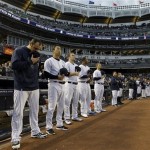 New York Yankees starting pitchers bow their heads during a moment of silence before a baseball game at Yankee Stadium in New York, Tuesday, April 16, 2013. From left, Joba Chamberlain, Hiroki Kuroda, Phil Hughes, CC Sabathia, Andy Pettitte (AP Photo/Kathy Willens)