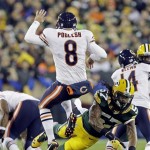 Green Bay Packers' Jamari Lattimore (57) blocks the punt of Chicago Bears' Adam Podlesh (8) during the first half of an NFL football game Monday, Nov. 4, 2013, in Green Bay, Wis. (AP Photo/Mike Roemer)