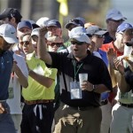 Tiger Woods is cheered by spectators as he walks up the 17th fairway during the third round of the Masters golf tournament Saturday, April 13, 2013, in Augusta, Ga. (AP Photo/David Goldman)
