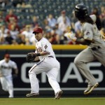Arizona Diamondbacks' Willie Bloomquist, middle, waits for a ground ball as Pittsburgh Pirates' Andrew McCutchen, right, runs to third base while Diamondbacks' Jason Kubel runs in from the outfield to back up the play during the first inning in an MLB baseball game Monday, April 16, 2012, in Phoenix.(AP Photo/Ross D. Franklin)