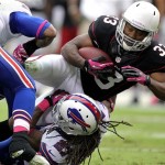 Arizona Cardinals running back William Powell (33) is stopped by Buffalo Bills cornerback Stephon Gilmore (27) during the first half on an NFL football game on Sunday, Oct. 14, 2012, in Glendale, Ariz. (AP Photo/Paul Connors)