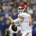 Kansas City Chiefs quarterback Alex Smith (11) passes the ball against the Indianapolis Colts during the first half of an NFL wild-card playoff football game Saturday, Jan. 4, 2014, in Indianapolis. (AP Photo/Michael Conroy)