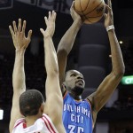 Oklahoma City Thunder's Kevin Durant (35) shoots in front of Houston Rockets' Francisco Garcia (32) in the first quarter of Game 6 in a first-round NBA basketball playoff series Friday, May 3, 2013, in Houston. (AP Photo/Pat Sullivan)
