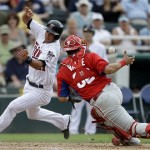 Philadelphia Phillies catcher Sebastian Valle, right, loses the ball as Minnesota Twins' Drew Butera, left, slides past to score off a single by Jeff Clement in the sixth inning of an exhibition spring training baseball game, Wednesday, Feb. 27, 2013, in Fort Myers, Fla. (AP Photo/David Goldman)