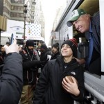  New York Jets head coach Rex Ryan, right, poses for a photo with a fan as Ryan hands out free ice cream from a truck Friday, Jan. 31, 2014 on Broadway in New York. Ryan was taking part in an "Embrace the Cold" promotion by the New Era Cap Company to promote their Super Bowl merchandise. The Seattle Seahawks will play the Broncos Sunday in the NFL Super Bowl XLVIII football game in East Rutherford, N.J. (AP Photo/Ted S. Warren)
