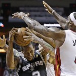 The Miami Heat's LeBron James (6) and Chris Andersen (11) defend San Antonio Spurs small forward Kawhi Leonard (2) during the first half of Game 2 of the NBA Finals basketball game, Sunday, June 9, 2013 in Miami. (AP Photo/Lynne Sladky)