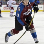  Colorado Avalanche center Nathan MacKinnon takes a shot on goal against the Phoenix Coyotes during the first period of an NHL hockey game on Friday, Feb. 28, 2014, in Denver. (AP Photo/Jack Dempsey)