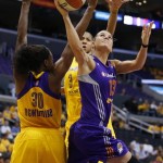 Phoenix Mercury's Penny Taylor, right, shoots as Los Angeles Sparks' Nneka Ogwumike, left and Candace Parker, rear, defend during the first half in Game 1 of their WNBA basketball Western Conference semifinal series on Thursday, Sept. 19, 2013, in Los Angeles. (AP Photo/Danny Moloshok)