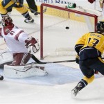  Nashville Predators forward Nick Spaling (13) scores against Phoenix Coyotes goalie Mike Smith (41) in the first period of an NHL hockey game Monday, Nov. 25, 2013, in Nashville, Tenn. (AP Photo/Mark Humphrey)