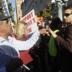 Raymond Herrera, a supporter of Arizona's new immigration law, left, argues with Gerardo Marin outside of a U.S. Circuit Court of Appeals building in San Francisco, Monday, Nov. 1, 2010. A federal appeals court is hearing arguments over Arizona's request to enforce its controversial new immigration law. (AP Photo/Jeff Chiu)