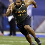 Penn State offensive lineman John Urschel runs a drill at the NFL football scouting combine in Indianapolis, Saturday, Feb. 22, 2014. The all-Big Ten, third-team AP All-American has a Master's degree in math and was awarded the William V. Campbell Trophy as college football's top scholar-athlete. (AP Photo/Michael Conroy)