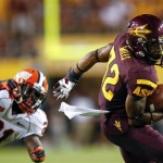 Arizona State wide receiver Jamal Miles (32) slips past Illinois defensive back Jack Ramsey (21) during the first half of an NCAA college football game, Saturday, Sept. 8, 2012, in Tempe, Ariz. (AP Photo/Matt York)
