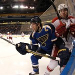 St. Louis Blues center David Backes, left, checks Phoenix Coyotes defenseman Keith Yandle during the first period of an NHL hockey game Tuesday, Jan. 14, 2014, in St. Louis. The Blues won 2-1. (AP Photo/St. Louis Post-Dispatch, Chris Lee) 
