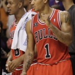 Chicago Bulls' Derrick Rose (1) and Keith 
Bogans watch the final seconds against the 
Phoenix Suns during the second overtime of an 
NBA basketball game Wednesday, Nov. 24, 2010, 
in Phoenix. The Bulls won 123-115. (AP 
Photo/Matt York)