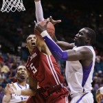 Washington State's Will Dilorio (5) battles for a rebound against Washington's Aziz N'Diaye in the first half during a Pac-12 tournament NCAA college basketball game, Wednesday, March 13, 2013, in Las Vegas. (AP Photo/Julie Jacobson)