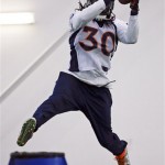 Denver Broncos safety David Bruton catches a pass during practice Thursday, Jan. 30, 2014, in Florham Park, N.J. The Broncos are scheduled to play the Seattle Seahawks in the NFL Super Bowl XLVIII football game Sunday, Feb. 2, in East Rutherford, N.J. (AP Photo)