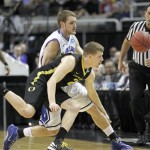 Saint Louis forward Jake Barnett (30) and Oregon forward E.J. Singler (25) battle for a loose ball during the second half of a third-round game in the NCAA college basketball tournament Saturday, March 23, 2013, in San Jose, Calif. Oregon won 74-57. (AP Photo/Tony Avelar)
