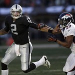  Oakland Raiders quarterback Terrelle Pryor (2) runs from Denver Broncos free safety Michael Huff (29) during the second half of an NFL football game, Sunday, Dec. 29, 2013, in Oakland, Calif. (AP Photo/Marcio Jose Sanchez)
