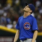 Chicago Cubs' Travis Wood looks up with dismay after giving up an run to the Arizona Diamondbacks during the sixth inning of a baseball game on Tuesday, July 23, 2013, in Phoenix. (AP Photo/Ross D. Franklin)