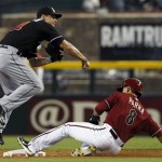 Arizona Diamondbacks' Gerardo Parra (8) is forced out at second base by Miami Marlins' Derek Dietrich during the first inning of a baseball game on Wednesday, June 19, 2013, in Phoenix. (AP Photo/Ross D. Franklin)