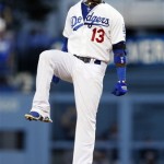 Los Angeles Dodgers' Hanley Ramirez jumps in the air over second base after he hit a double in the third inning of Game 3 of the National League division baseball series against the Atlanta Braves, Sunday, Oct. 6, 2013, in Los Angeles. (AP Photo/Danny Moloshok)