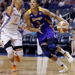 Phoenix Mercury's Candice Dupree (4) defends as Los Angeles Sparks' Candace Parker (3) drives during the first half of Game 2 of a WNBA basketball Western Conference semifinal series, Saturday, Sept. 21, 2013, in Phoenix. (AP Photo/Matt York)