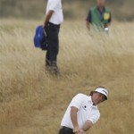 Phil Mickelson of the United States chips a ball onto the 16th green during the final round of the British Open Golf Championship at Muirfield, Scotland, Sunday, July 21, 2013. (AP Photo/Jon Super)